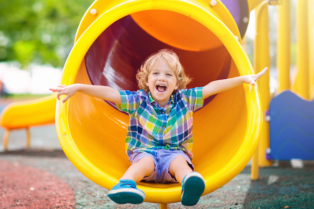 Preschoolers laughing together during group play