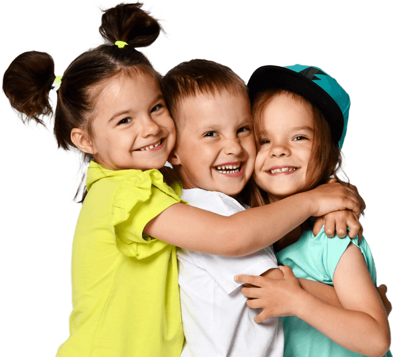 Three children embrace each other joyfully, their faces lit up with smiles, showcasing a moment of friendship and happiness.