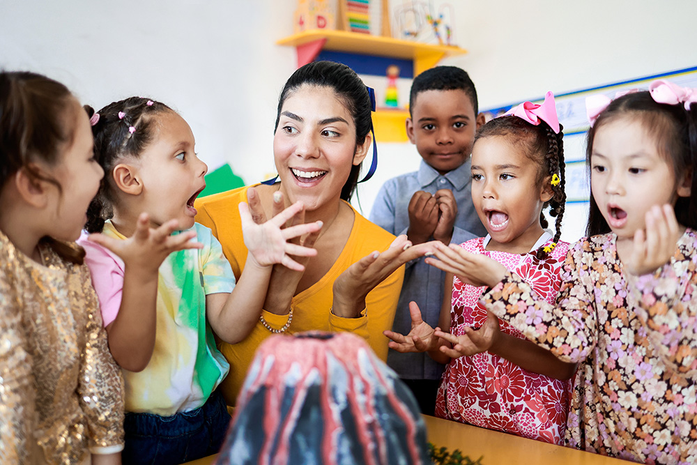 A teacher engaging with students in a vibrant classroom setting, fostering a collaborative learning environment.