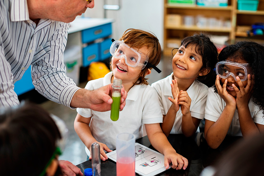 A classroom scene where a teacher is actively teaching a diverse group of children, fostering a learning environment.